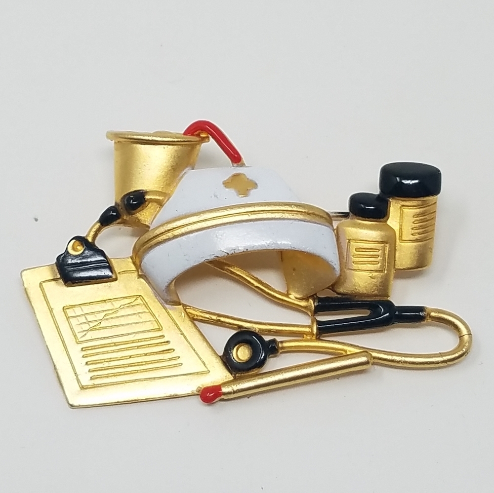 Vtg AJC gold tone retro nurse themed brooch